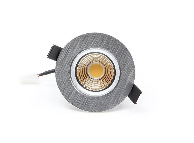 Runde LED-Lampe in gebürstetem Metallgehäuse mit zentralem Leuchtpunkt und elektrischem Anschlusskabel.