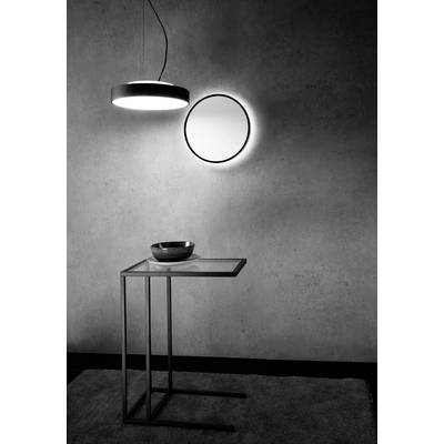 Schwarz-Weiß-Foto eines minimalistischen Interieurs mit modernen Möbeln: Tisch mit Glasscheibe, runde Lampe, runder Spiegel an der Wand.