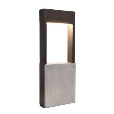 Ein modernes Gartendesign aus Beton und Metall, das als stilvolle Beleuchtung dient.