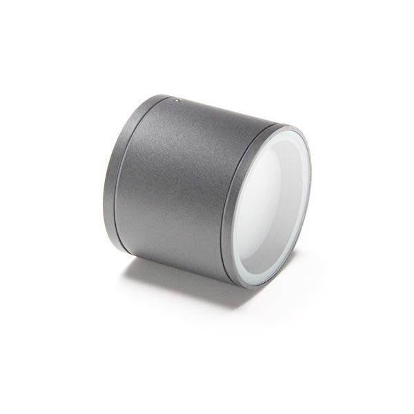 Silberner, zylindrischer Gegenstand mit einer weißen, leicht gewölbten Oberfläche auf einer Seite.