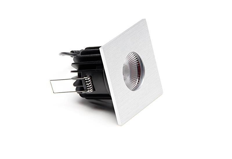 Quadratische LED-Einbauleuchte mit gebürsteter Metalloberfläche, zylindrischem Leuchtkörper und schwarzem Gehäuserahmen.
