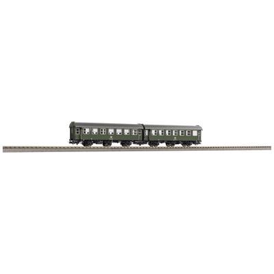 Zwei grüne Modelleisenbahn-Personenwagen auf einem Gleis.