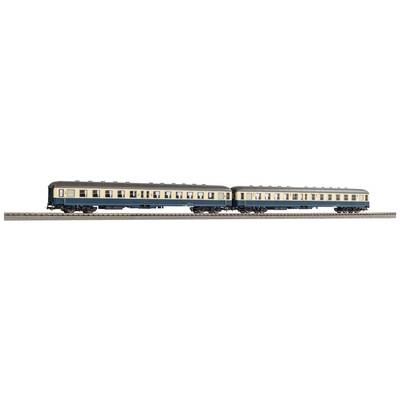 Zwei blaue und beige Modellbahnwaggons stehen auf Schienen, repräsentieren historische Zugmodelle.