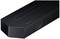 Eine schwarze Soundbar mit der Aufschrift 'Samsung'. Sie hat ein modernes Design und besteht aus einem feinen, perforierten Gitter.