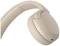 Beige Kopfhörer mit mehreren Bedienknöpfen an der Seite, zeigt modernes Design und drahtlose Funktion.