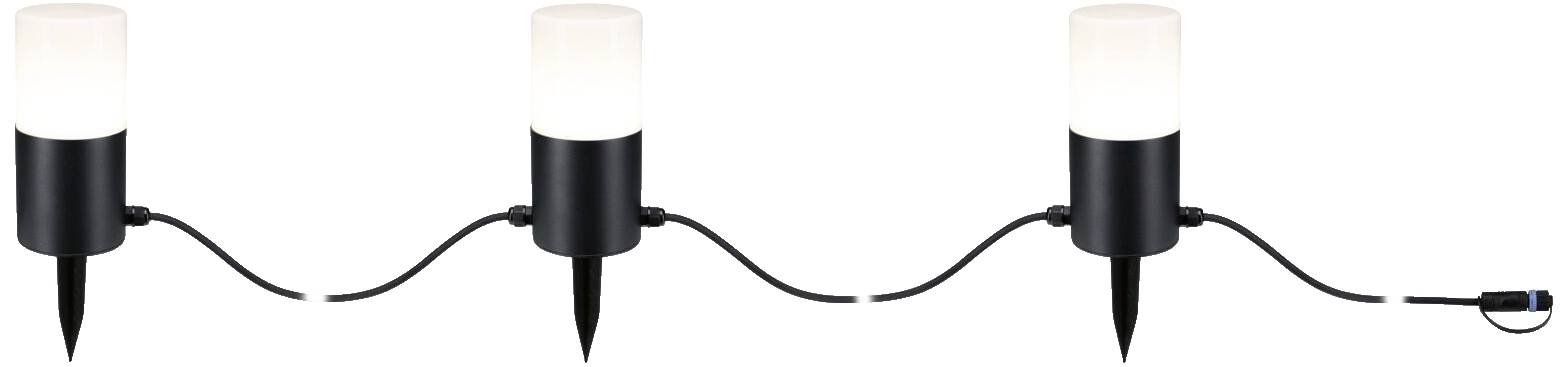 Drei schwarze Außenleuchten mit Erdspießen und verbundenen Kabeln. Jede Lampe hat einen weißen, zylindrischen Leuchtkörper.