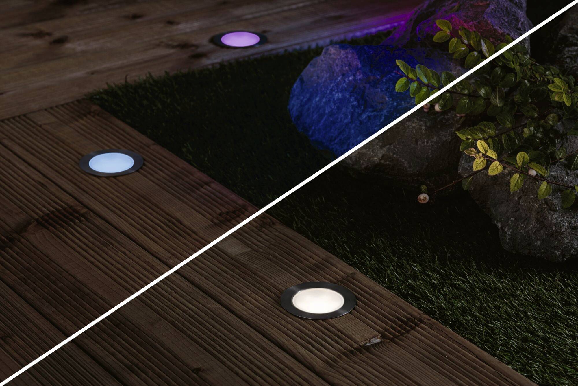Holzterrasse mit eingelassenen LED-Bodenleuchten in verschiedenen Farben, umgeben von Pflanzen und Steinen.