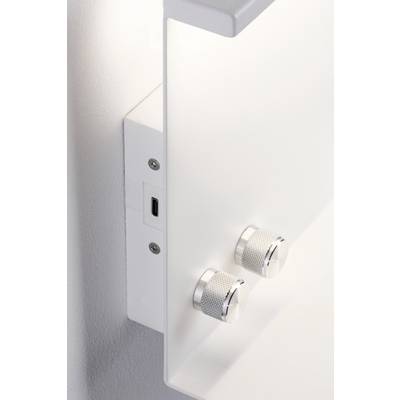 Ein weißes Steuergerät mit zwei silbernen Drehknöpfen an der Wand montiert.
