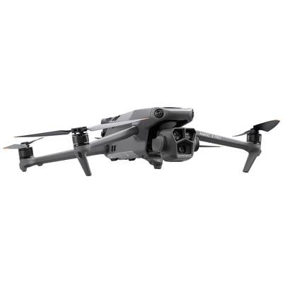 Graue Drohne mit vier Rotoren und Kamera. Seitenansicht zeigt technische Details und aerodynamisches Design. An Drone-Einsatz denken.