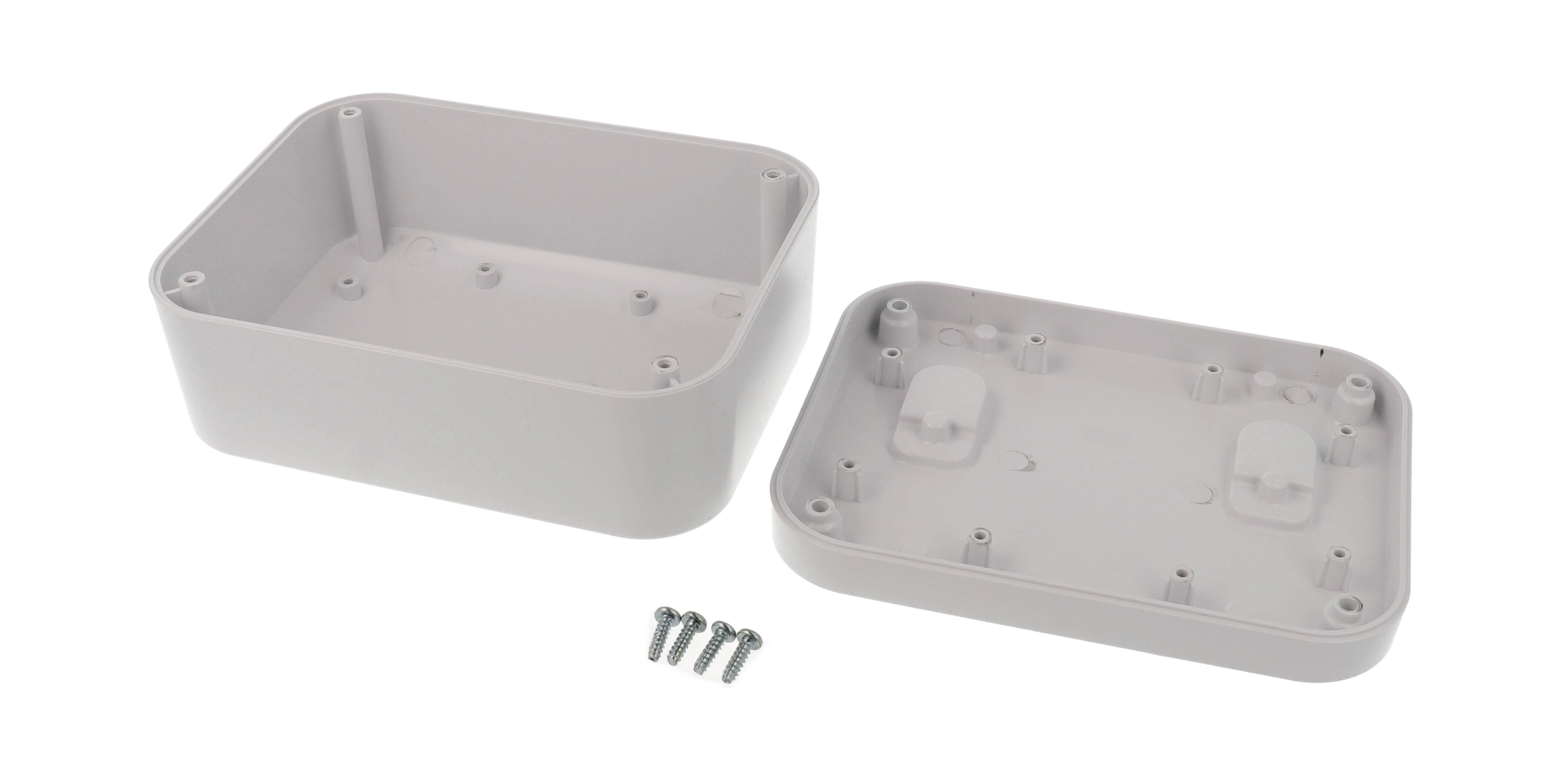 Graues rechteckiges Gehäuse aus Kunststoff, bestehend aus zwei Teilen, die für die Montage vorgesehen sind, mit vier Schrauben.