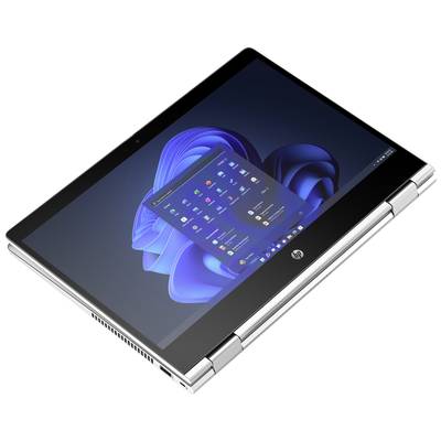 Ein silberner Laptop im Tablet-Modus mit geöffneter Windows-Benutzeroberfläche, zeigt Startmenü-Apps und ein Hintergrundbild in Blau.
