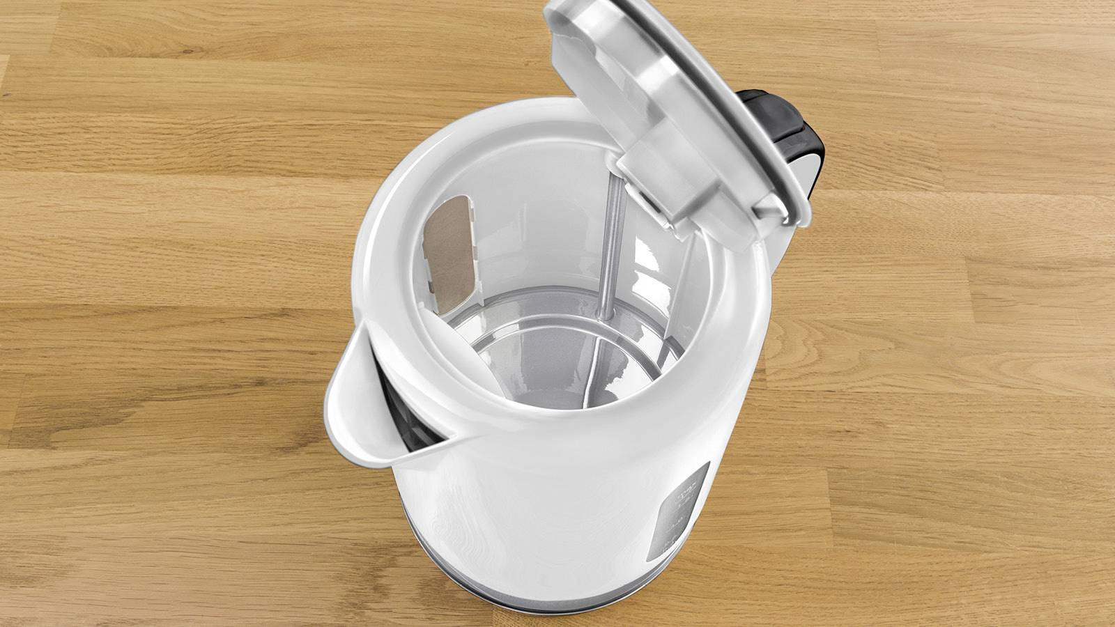 Ein geöffneter, weißer Wasserkocher steht auf einer Holzoberfläche. Der Innenraum des Wasserkochers ist deutlich sichtbar.