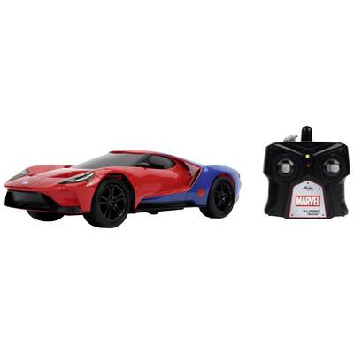 Rotes und blaues Spielzeugauto im Stil eines Rennwagens, daneben eine schwarze Fernbedienung mit 'Marvel Turbo Racer' Aufschrift.