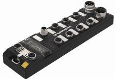 Ein schwarzes elektronisches Modul mit mehreren runden Anschlüssen und dem Schriftzug 'TURCK' auf der Oberseite.