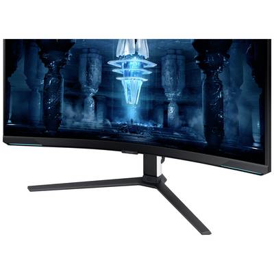 Ein gebogener Gaming-Monitor mit leuchtendem Bildschirm zeigt ein futuristisches digitales Design in Blau- und Schwarztönen.