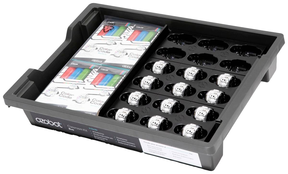 Eine Schale enthält mehrere Ozobots, kleine runde Roboter, in separaten Fächern; daneben verpackte Zubehörteile.