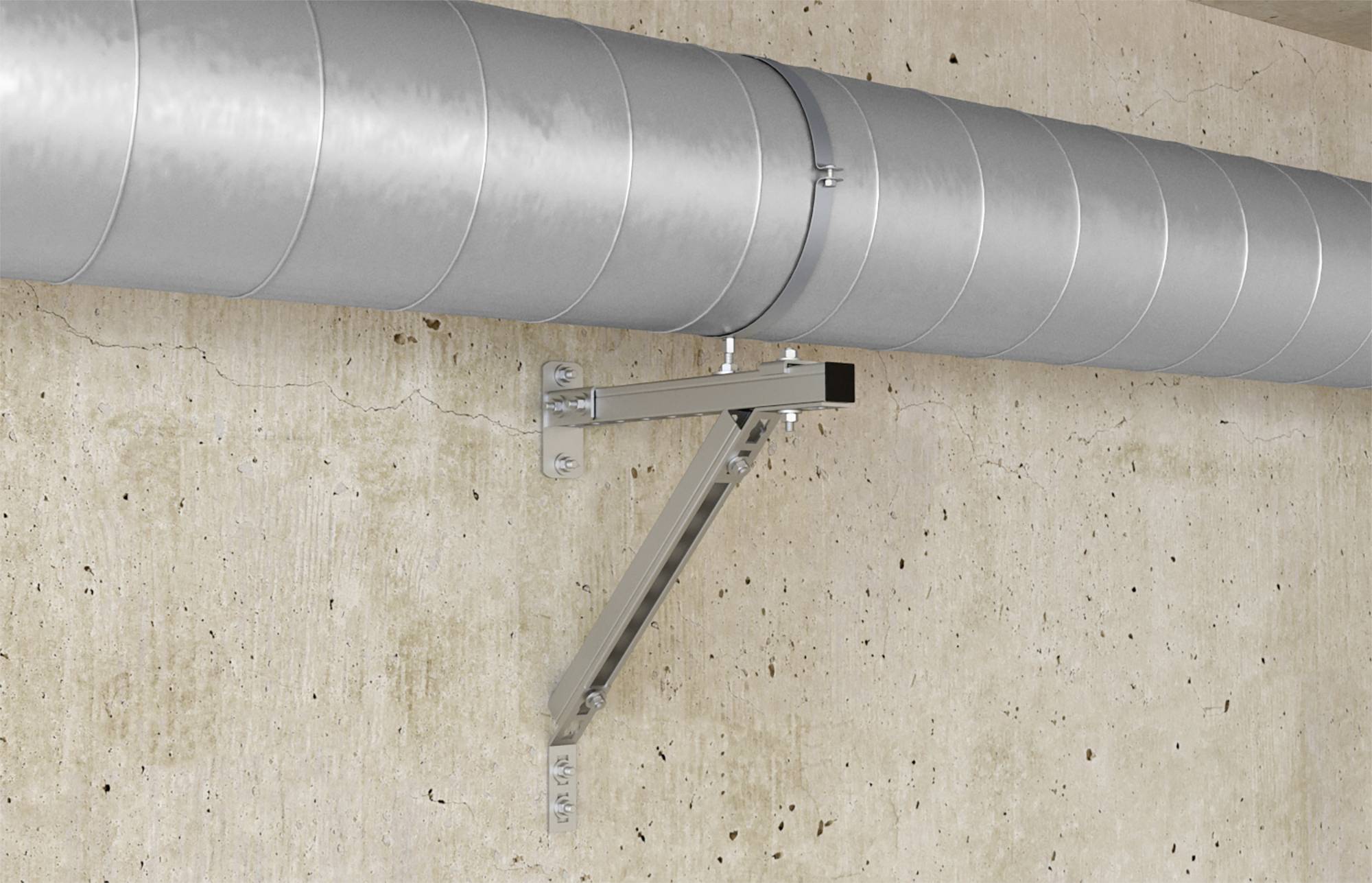 Eine silberne Rohrleitung ist an einer Betonwand befestigt. Die Halterung stützt das Rohr sicher an der Wand.