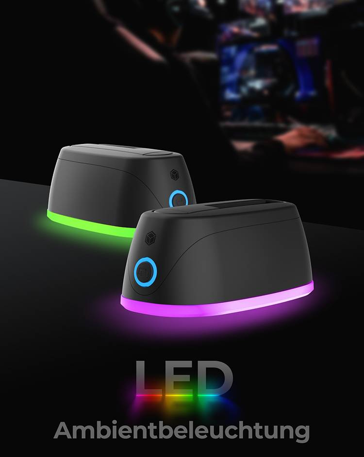 Zwei schwarze LED-Lampen mit farbigen Lichtern (grün und lila) strahlen auf dunklem Hintergrund. Text darunter: 'LED Ambientbeleuchtung'.