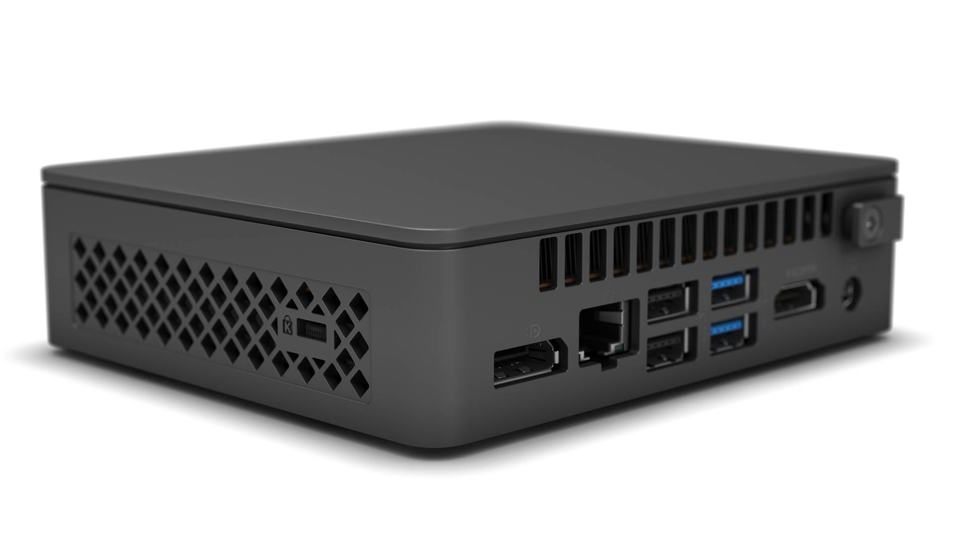 Ein kleiner, schwarzer Mini-PC mit mehreren Anschlüssen auf der Rückseite, einschließlich USB, HDMI und Ethernet.