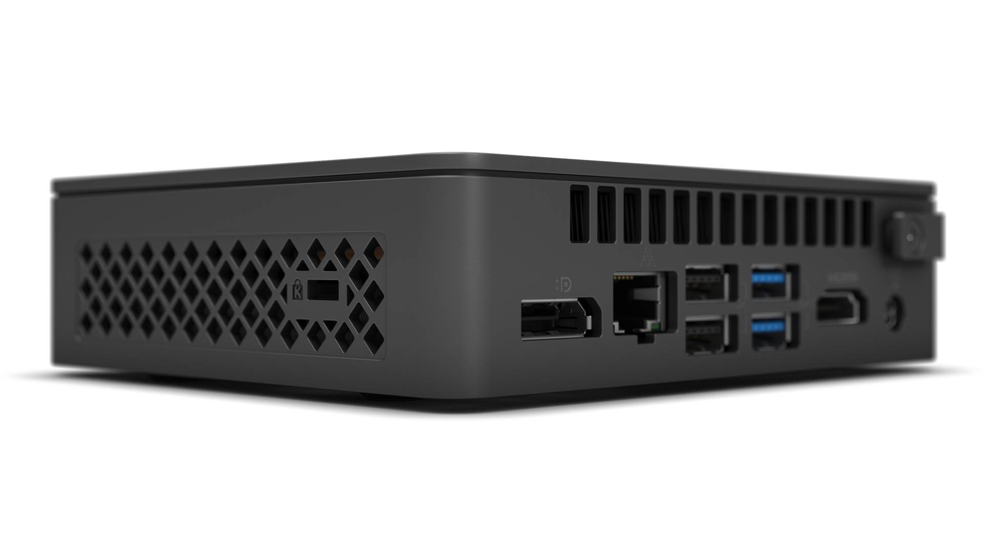 Ein schwarzer Mini-PC von der Seite gezeigt, mit mehreren USB-Ports, einem HDMI-Anschluss und Lüftungsschlitzen.
