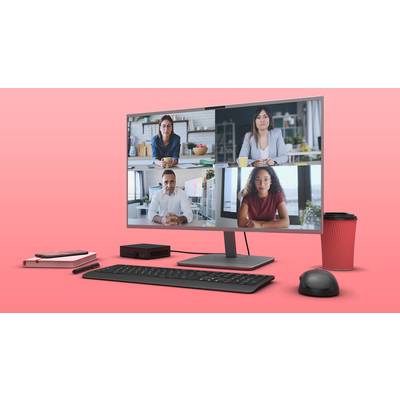 Vier Personen in einem virtuellen Meeting auf einem Computerbildschirm, der auf einem Schreibtisch mit Tastatur und Kaffeetasse steht.