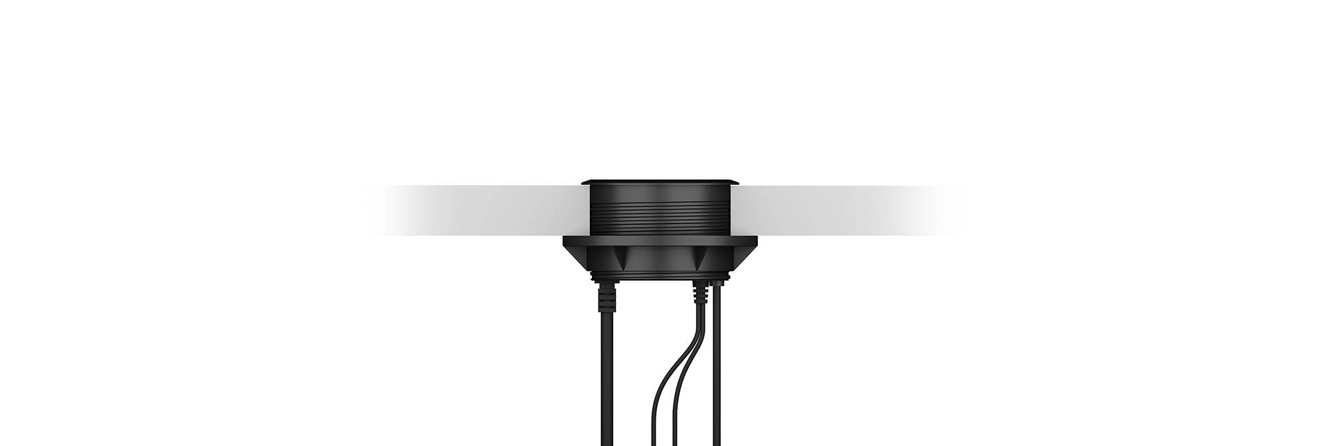 Ein rundes schwarzes Gerät ist an einer glatten, horizontalen weißen Oberfläche montiert, mit drei Kabeln, die nach unten führen.