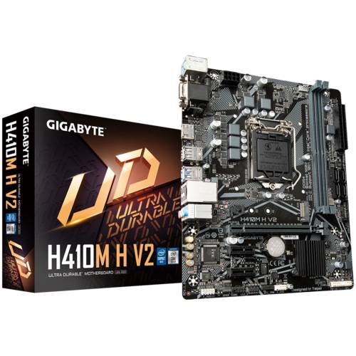 'GIGABYTE H410M H V2 Ultra Durable Motherboard' vor dem Verpackungskarton mit 'Ultra Durable' Schriftzug. Die Hauptplatine zeigt Anschlüsse und Komponenten.