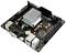 Eine schwarze Computer-Motherboard-Platine mit mehreren Anschlüssen und einem auffälligen Kühlkörper in der Mitte.