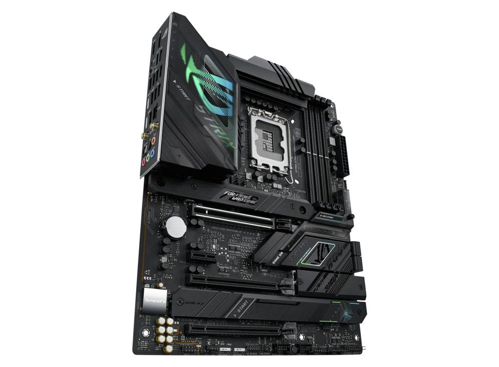 Ein schwarzes Computer-Motherboard mit grünem Beleuchtungsmuster. Sichtbare Steckplätze und Buchsen für verschiedene Computerkomponenten.