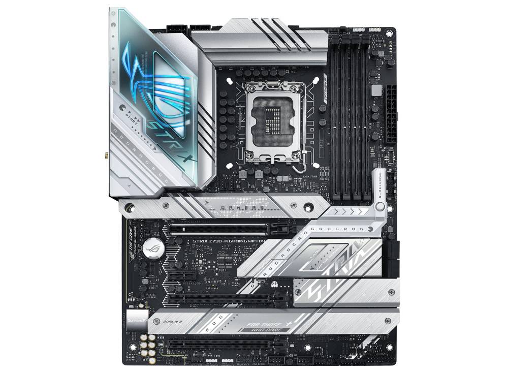 Ein Computer-Mainboard mit markanter silberner und schwarzer Farbgebung. Sitz des Prozessors ist zentral. RAM-Steckplätze rechts.