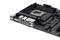 Eine schwarze Computer-Mainboard-Platine mit mehreren USB-Anschlüssen, Audiobuchsen und einem CPU-Steckplatz.
