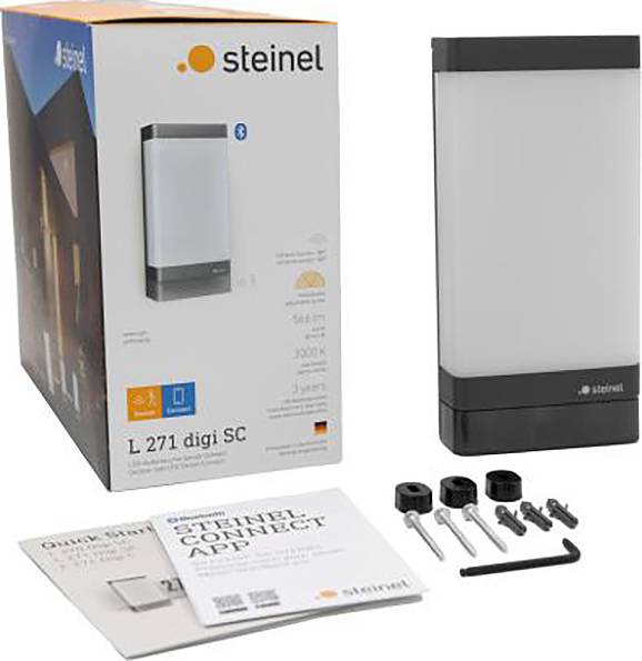 Steinel Außenleuchte, Modell L 271 digi SC, Verpackung und Zubehör abgebildet. Inkl. Halterungen, Schrauben und Anleitung.