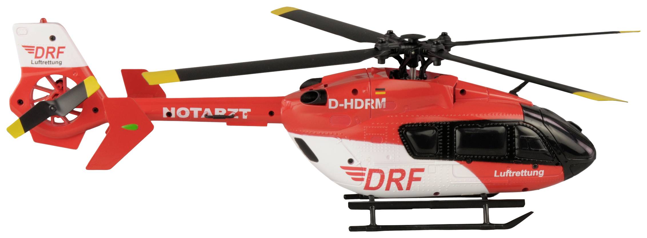 Ein roter und weißer DRF-Rettungshubschrauber mit der Aufschrift 'NOTARZT' auf der Seite.