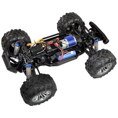 Ein ferngesteuertes Auto ohne Karosserie, zeigt Motor, Batterie und Elektronik auf einem schwarzen Chassis mit robusten Offroad-Reifen.