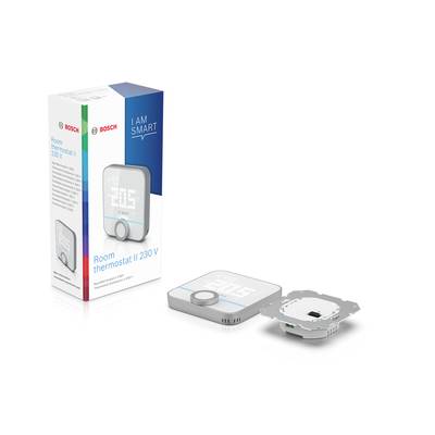 Raumthermostat mit LED-Display, Einstellungsknopf und Verpackung im Hintergrund. Text auf Verpackung: 'Room thermostat II 230 V'.