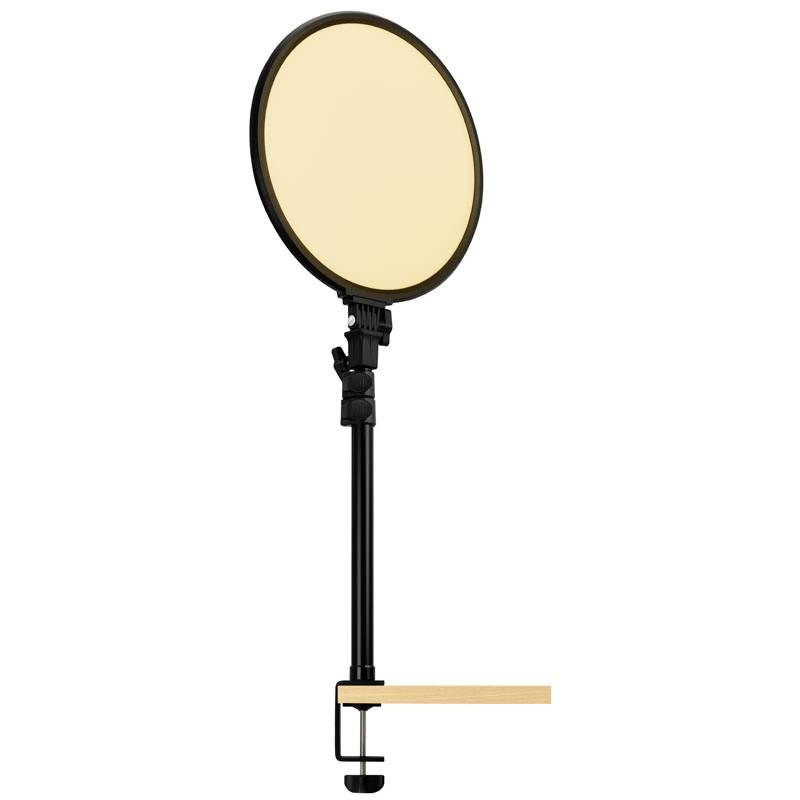 Ein runder LED-Ringlichtkopf mit Stativhalterung, der an einem Tisch befestigt ist, bietet gleichmäßige Beleuchtung für Video- oder Fotografie.