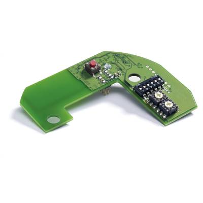Eine grüne Leiterplatte mit einem roten Knopf und elektronischen Bauteilen. Sie ist trapezförmig und enthält verschiedene Schaltkreise.