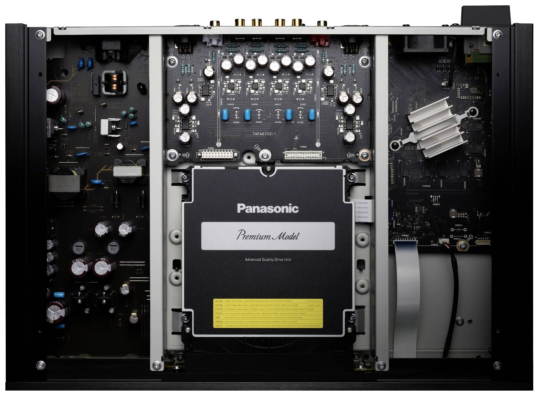 Ein geöffnetes elektronisches Gerät mit sichtbaren internen Komponenten und einer zentralen Einheit mit der Aufschrift 'Premium Module'.