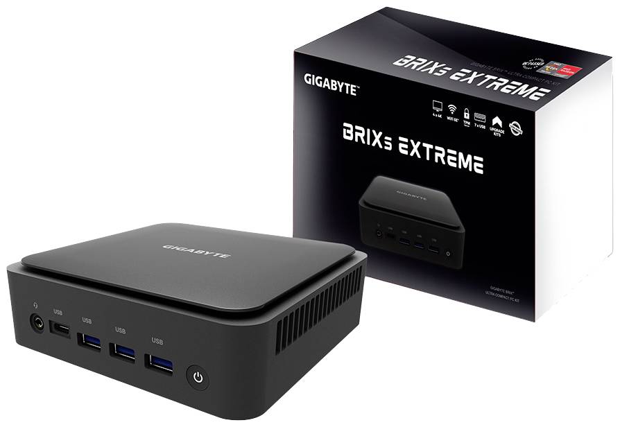 Ein kompakter schwarzer Mini-PC von GIGABYTE, Modell 'BRIX Extreme'. Im Hintergrund ist die Verpackung mit dem gleichen Design zu sehen.