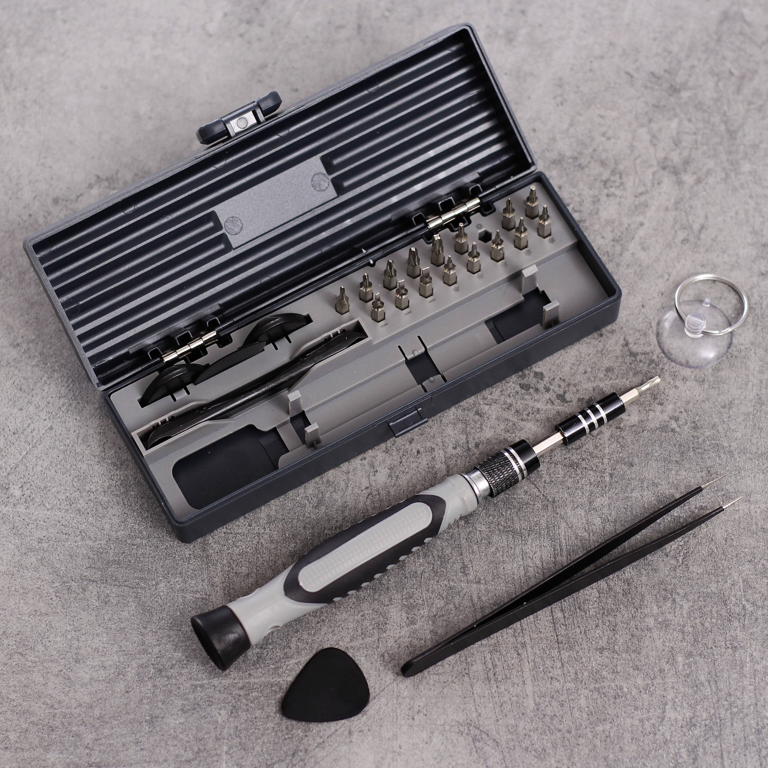 Werkzeugset mit Präzisionsschraubendreher, Bits, Pinzette und Saugnapf auf grauem Hintergrund. Hauptsächlich für Elektronikreparaturen.