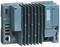Steuerungsmodul von Siemens 'SIMATIC ET 200SP', zeigt mehrere Anschlüsse, darunter USB-Ports und einen Ethernet-Port, auf einer grauen Oberfläche.