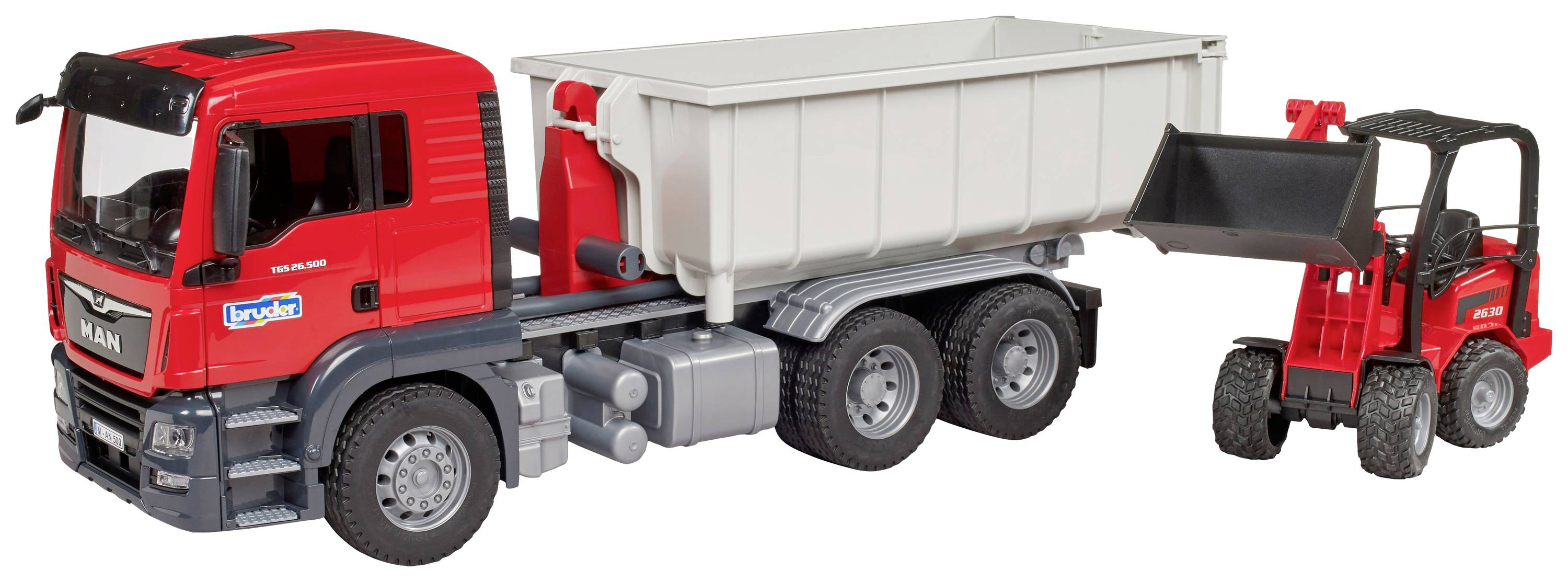 Ein rotes Spielzeug-Lastwagenmodell mit Container, daneben ein kleiner roter Frontlader, der Erde in den Container lädt.