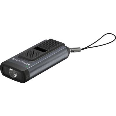 Kleiner, rechteckiger Taschenlampenanhänger mit LED-Licht und Handschlaufe, auf der eine kleine grüne Betriebsanzeige leuchtet.