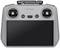 Ein grauer Handheld-Controller mit zwei Joysticks und einem Display darunter. Mehrere Tasten zur Steuerung sind ebenfalls vorhanden.