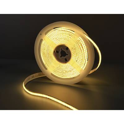 Eine aufgerollte LED-Lichterkette, die warmweiß leuchtet, liegt auf einem dunklen Hintergrund.