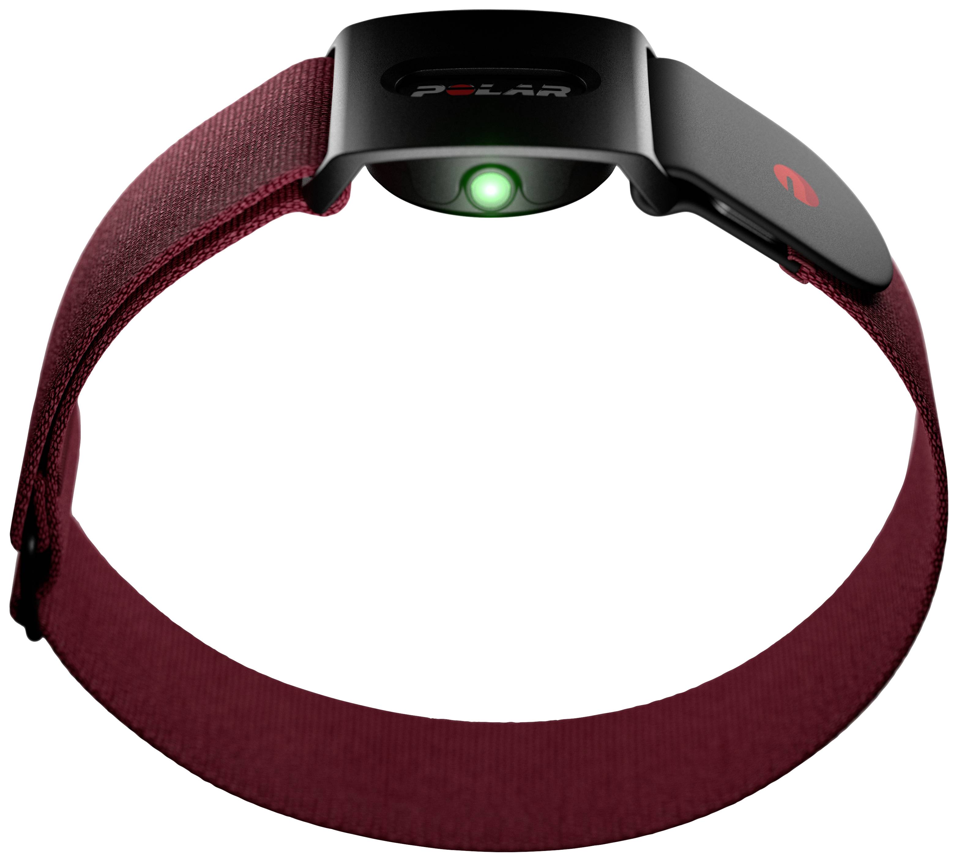 Ein rotes Armband mit einem schwarzen Sensor in der Mitte. Der Sensor hat ein grünes Licht und wird möglicherweise zur Herzfrequenzmessung verwendet.