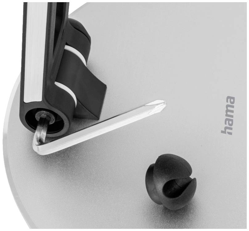 Ein Metallständer hält ein schwarzes Kabel, das mit einem Kunststoffclip befestigt ist. Im Hintergrund ist das Logo 'hama' zu sehen.