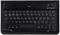 Schwarze kabellose QWERTZ-Tastatur mit Funktionstasten, Pfeiltasten und deutschem Layout. Oben rechts LEDs für Verbindung und Ladestatus.