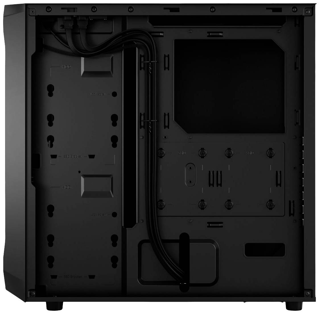 Ein Computergehäuse von innen, ohne eingebaute Komponenten. Kabelmanagement-Schächte sind sichtbar, ebenso wie Halterungen für Festplatten.