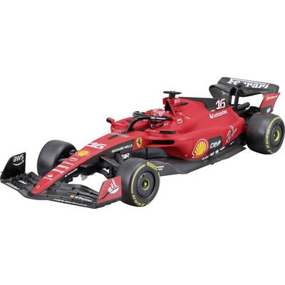 Ein roter Formel-1-Rennwagen mit Shell- und Ferrari-Logos, schwarzer Spoiler, Fahrer trägt roten Helm.